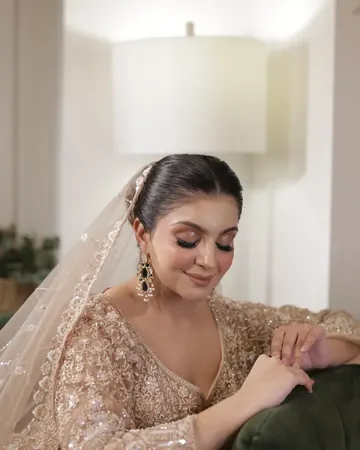 Bride in a red dupatta, makeup by Samia