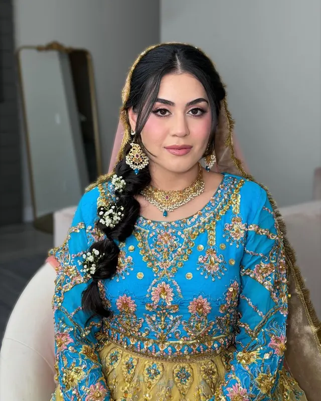 Bride in turquoise and yellow with a braided look, makeup by Samia